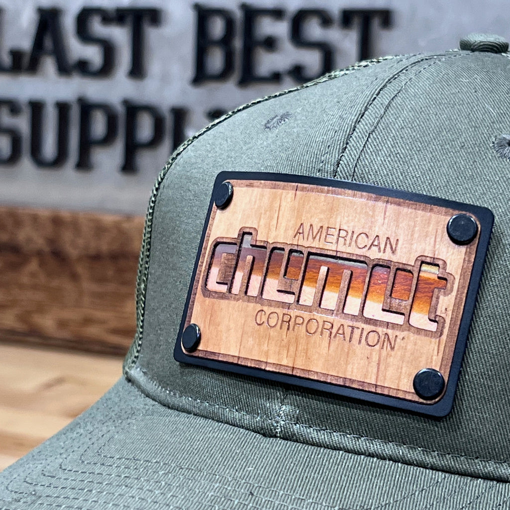 a wood and copper patch riveted to a hat made for a business